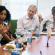 New York Times Publisher Arthur Sulzberger Jr., listens to a question from Kendall Trammell, second from left, during a luncheon with students from the New York Times Student Journalism Institute in 2016 in the newsroom building in Manhattan. (James Tensuan/New York Times Student Journalism Institute)